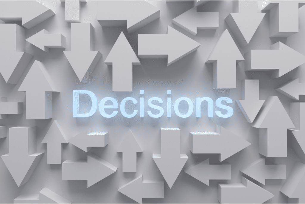 Image of grey arrows pointing in different directions and the word 'Decisions' in blue in the centre